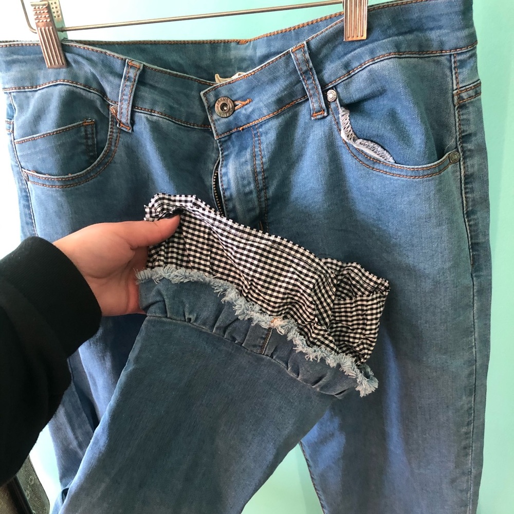 Denim jeans with bell bottom plaid on the bottom